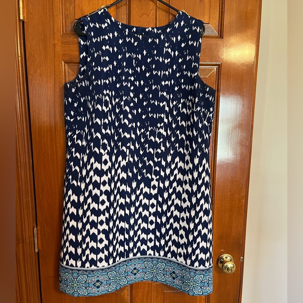 Sleeveless navy blue and white dress with multicolored border